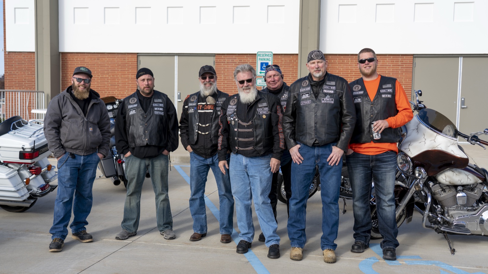 A group portrait of EWRC1 members in their club vests.