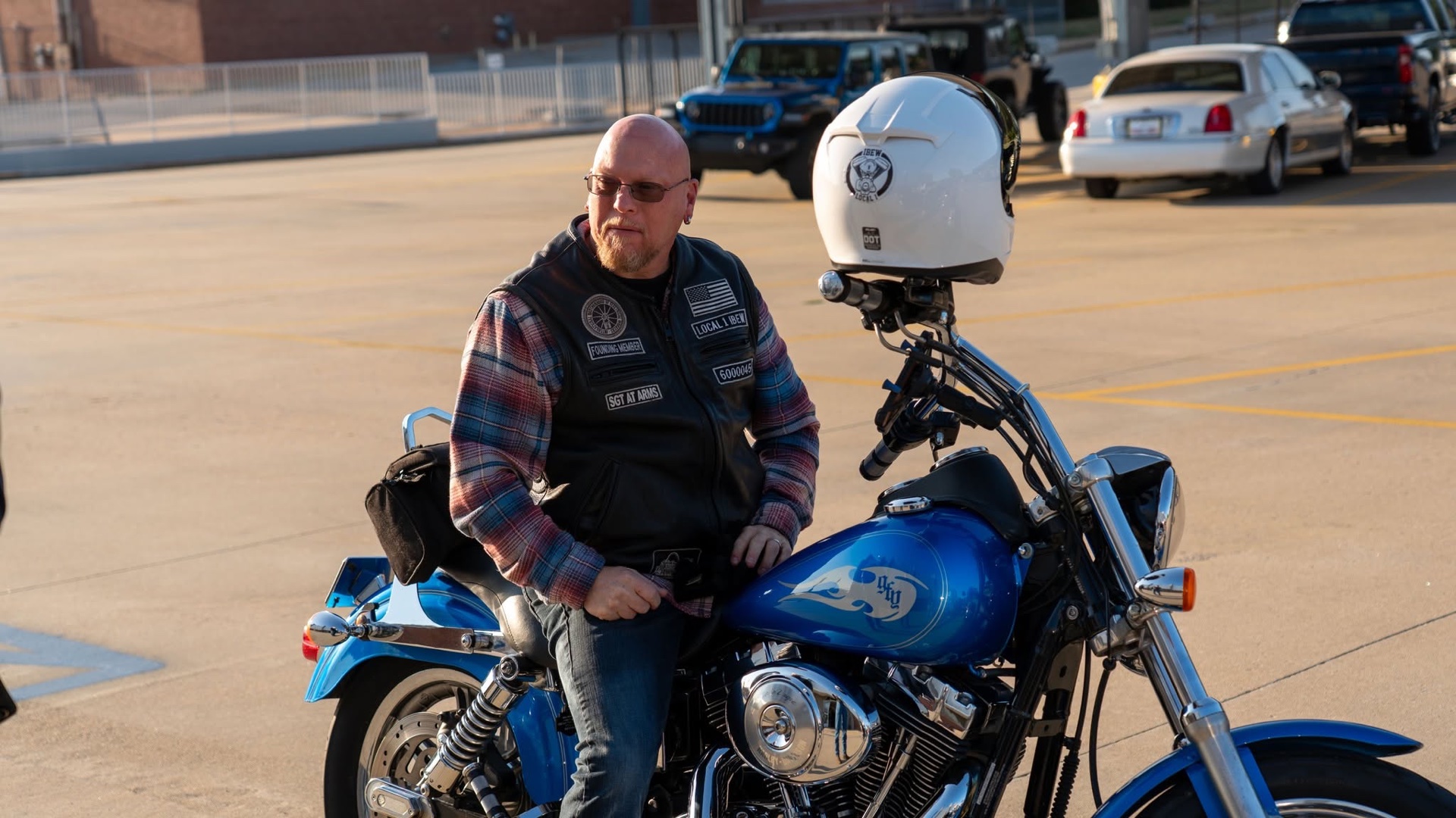 Mike Vartanian, EWRC1 Communications officer, on his blue Harley in the Local 1 parking area.