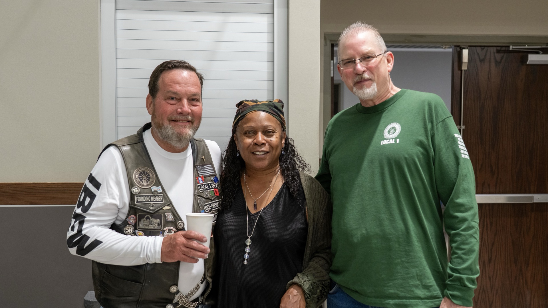 Patrick Bittick, EWRC1 Vice President (left), with his wife (center) and Chuck DeMoulin (right) at the Local 1 hall.